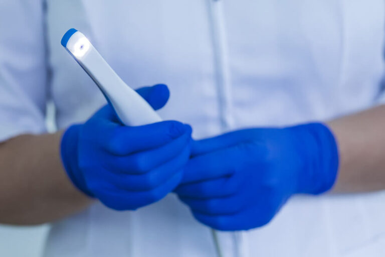 doctor holding a intraoral camera