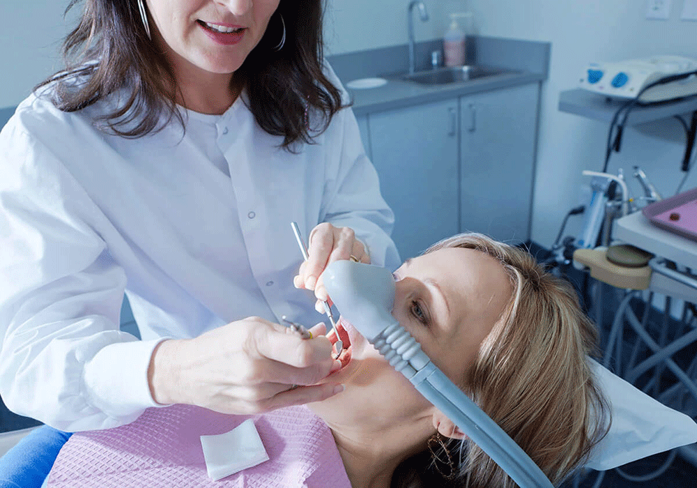patient receiving using sedation dentistry as they receive dental treatment