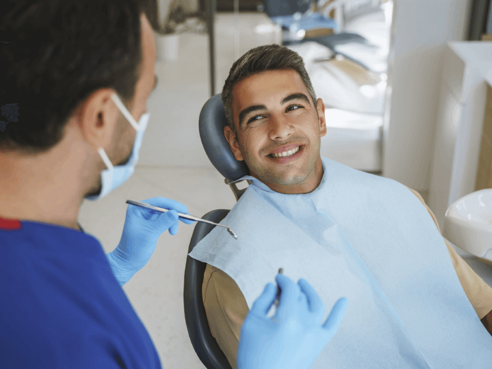 man smiling and receiving a smile makeover