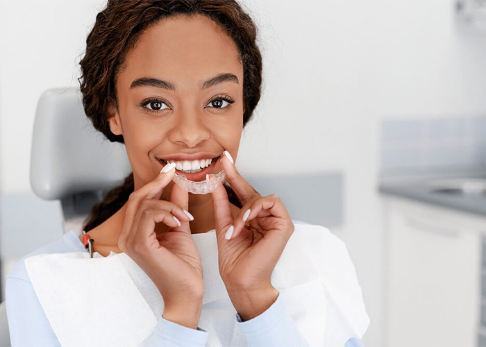 woman receiving Invislaign® treatment at Needville Family Dental in Needville, TX