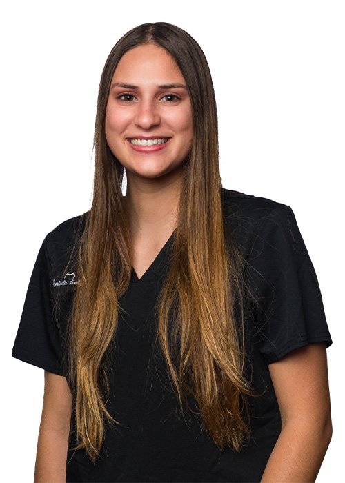 Paola, a registered dental assistant at Needville Family Dentistry